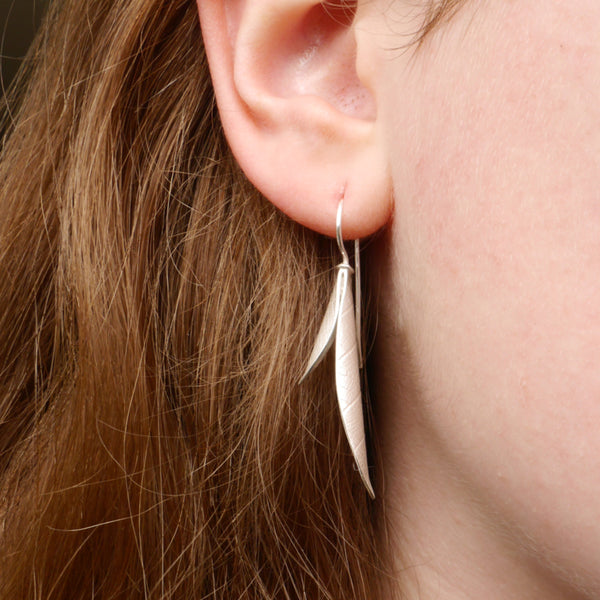 Long curved seed pod earring