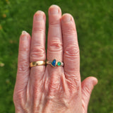 Blue green zebra stripe opal and emerald ring