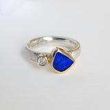 Bright blue opal and diamond ring