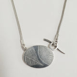 Dendritic quartz oval pendant