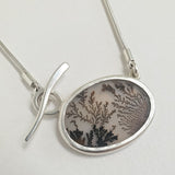 Dendritic quartz oval pendant