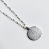 Antique mother of pearl disc pendant