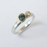 Offset sapphire and diamond ring