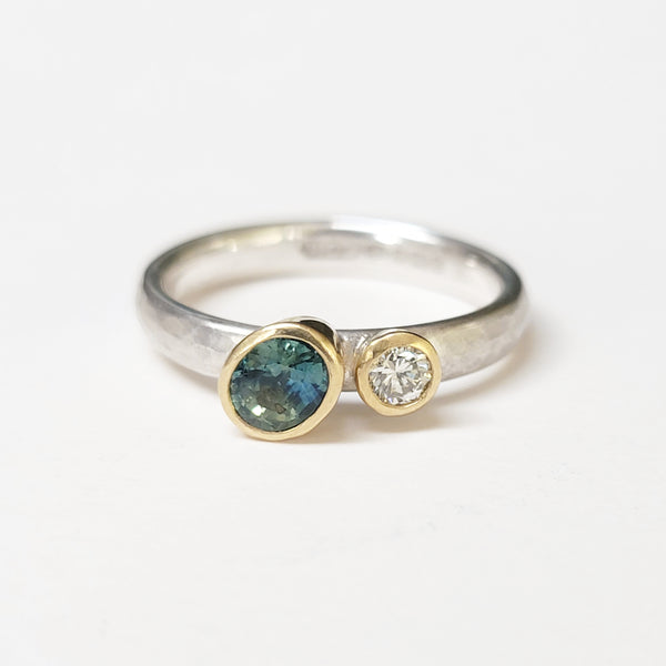 Offset sapphire and diamond ring