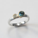 Offset sapphire and diamond ring