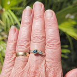 Offset sapphire and diamond ring