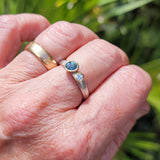 Offset sapphire and diamond ring