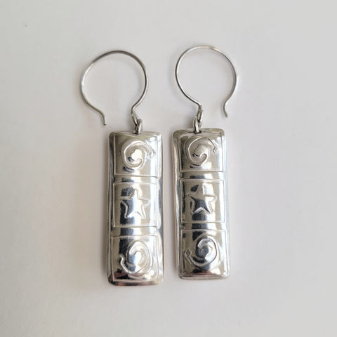Spiral and star pillow earring