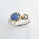 Star sapphire and grey diamond ring