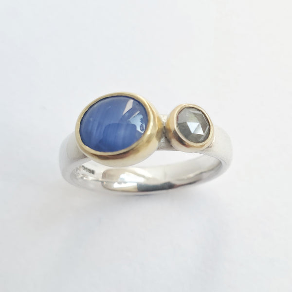 Star sapphire and grey diamond ring