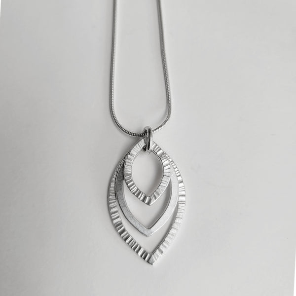 Triple hammered pendant