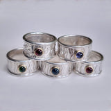 Wide wavey or spotty ring with stone