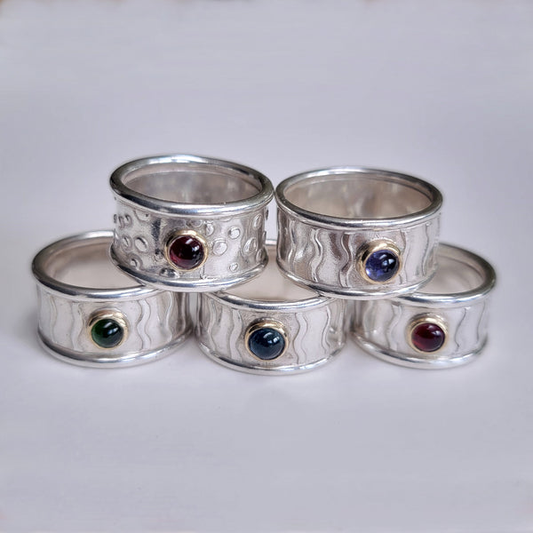 Wide wavey or spotty ring with stone