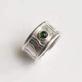 Wide wavey or spotty ring with stone