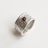 Wide wavey or spotty ring with stone