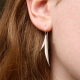 Long curved seed pod earring