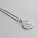Pierced leaf pendant